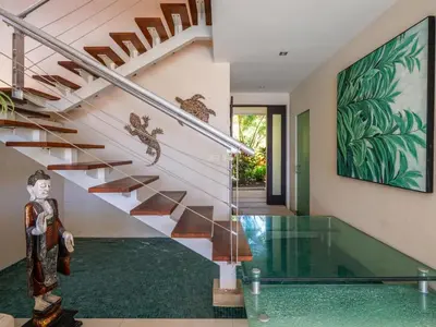 a staircase in a house with a glass floor at Casa White Duplex Beautiful beach houses in Sámara