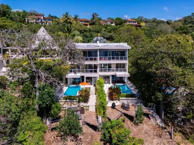 an aerial view of a house with a swimming pool at Casa White Duplex Beautiful beach houses in Sámara