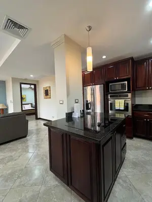 a large kitchen with a large island in a house at Monaco Condominiums, Jacó, Costa Rica - Luxury 3 Bedrooms in Jacó