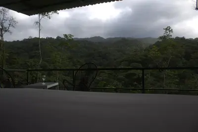 a view of the mountains from a balcony of a house at Village Río Celeste, Eco Lodge and Tours in Rio Celeste