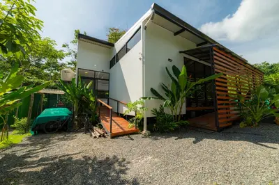 a small house with a lot of windows at Modern studio near Santa Teresa beach in Boca de Ario