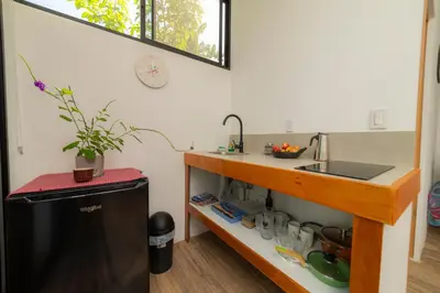 a small kitchen with a sink and a counter at Modern studio near Santa Teresa beach in Boca de Ario