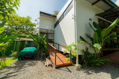 a house with a staircase in front of it at Modern studio near Santa Teresa beach in Boca de Ario