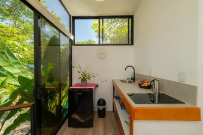 a small kitchen with a sink and a window at Modern studio near Santa Teresa beach in Boca de Ario