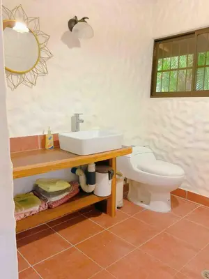 a bathroom with a sink and a toilet at Casa Francesca Beautiful house with a large garden in Sámara