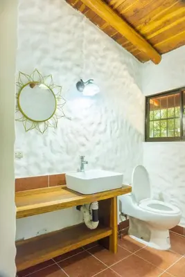 a bathroom with a sink and a toilet at Casa Francesca Beautiful house with a large garden in Sámara