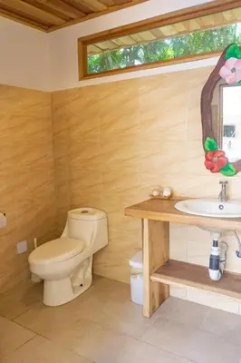 a bathroom with a toilet and a sink at Casa Francesca Beautiful house with a large garden in Sámara