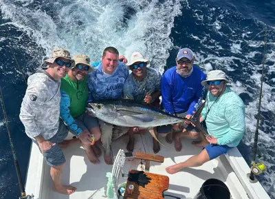 a group of people on a boat with a fish at Aloha Surf Nosara - Casa 'Ohana in Nosara