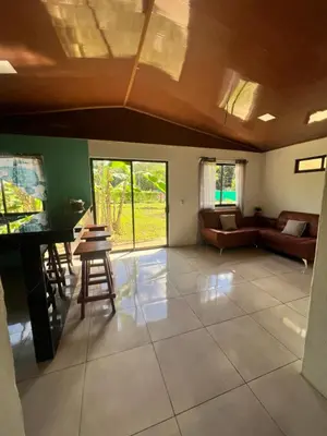 a living room with a couch and a table at Casa de playa in Playa Avellana