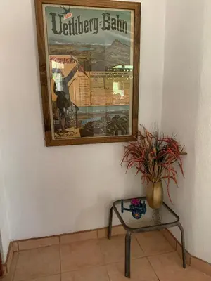 a vase sitting on a table next to a mirror at Oceana Breeze Perfect Getaway steps from the beach in Sámara