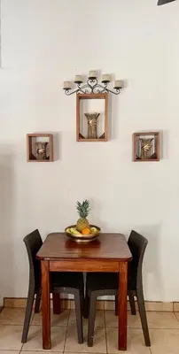 a dining room table with a pineapple on top of it at Oceana Breeze Perfect Getaway steps from the beach in Sámara