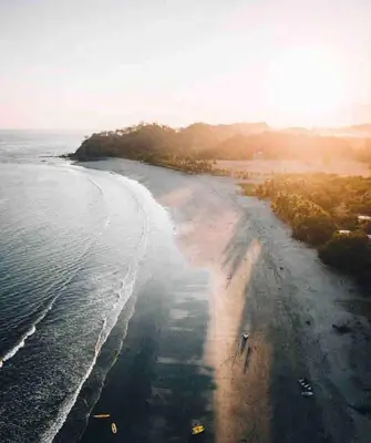 an aerial view of a beach with the ocean at Oceana Breeze Perfect Getaway steps from the beach in Sámara