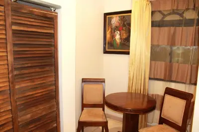 a room with a table and two chairs and a door at Sportsmens Lodge - Gentlemen's Club in San José