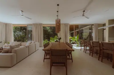 a living room with a couch and a table and chairs at Casa Solomia Luxury Oceanview 5 min to the Beach in Mal País