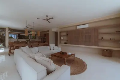 a living room with a white couch and a table at Casa Solomia Luxury Oceanview 5 min to the Beach in Mal País