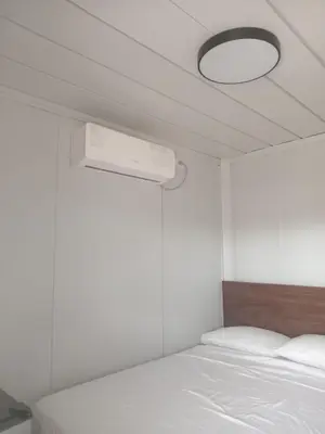 a bedroom with a bed and a ceiling fan at Cabinas Nena in Esparza