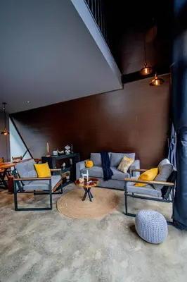 a living room with two couches and a table at Cozy Volcano View Stay Brand New & Hot Tub in Fortuna