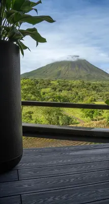 a view of a mountain from a balcony at Cozy Volcano View Stay Brand New & Hot Tub in Fortuna