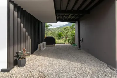 a hallway of a house with a door open at Cozy Volcano View Stay Brand New & Hot Tub in Fortuna