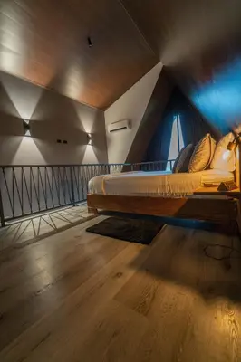 a room with a bed in the middle of a room at Charming Cabin in La Fortuna wHot Tub Brand new! in Fortuna