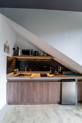 a kitchen with a sink and a microwave at Charming Cabin in La Fortuna wHot Tub Brand new! in Fortuna