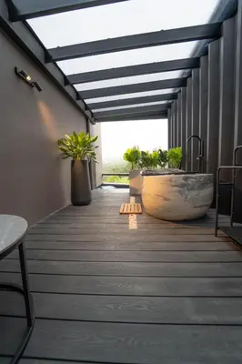 a bathroom with a large tub and a sink at Charming Cabin in La Fortuna wHot Tub Brand new! in Fortuna