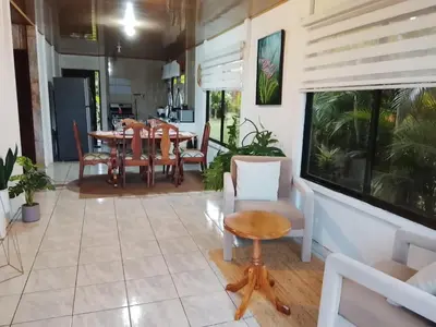a dining room with a table and chairs at Casa Lago in El Castillo de La Fortuna