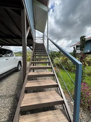 a staircase leading up to a house with a car at Suite Palm in Palma
