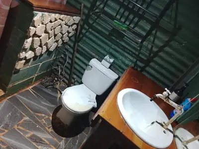 a bathroom with a toilet and a sink at Casa Victoria in Ojochal