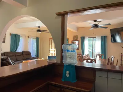 a kitchen with a bottle of water on a counter at Casa Aloha on Los Mangos Street in Nosara