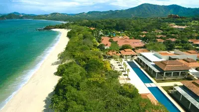 an aerial view of a resort on the beach at The Luxury Condo at Reserva Conchal, Great Beach in Playa Conchal