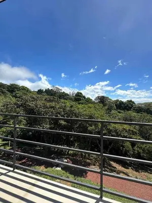 a view of a hill from a bridge at Poás Natural in Alajuela City