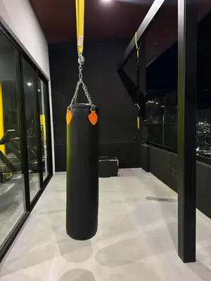 a black container hanging from a chain in a room at Edificio SER Barrio Escalante in San José