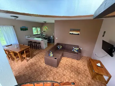an overhead view of a living room with a couch and a table at NeyHouse in Sarapiquí