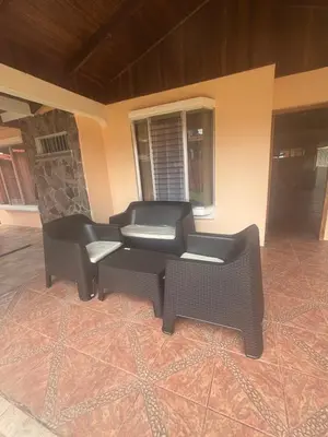 two chairs and a couch in a living room at Casa Vista al Volcan, La Fortuna in Fortuna