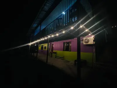 a train sitting in a train station at night at Paraíso Natural in Quepos