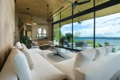 a living room with white furniture and large windows at Villa Coral in Nacascolo