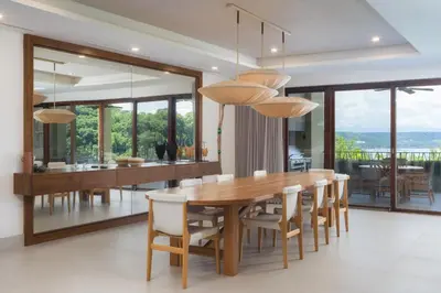 a dining room with a wooden table and chairs at Villa Tortuga in Nacascolo
