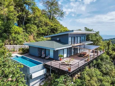 an aerial view of a house with a swimming pool at Villa with Stunning Isla Tortuga Ocean View, Near Curu Park & Ferry in Blue Zone in Paquera