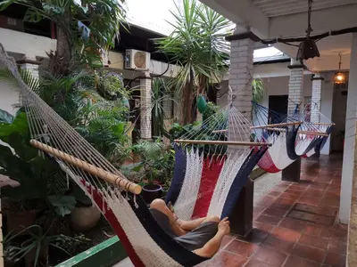 an image of two hammocks with an american flag at Hotel Aldea Pura Vida in Puntarenas