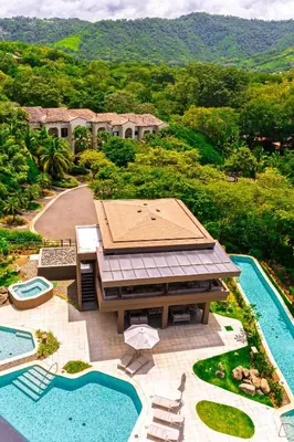 an aerial view of a resort with a swimming pool at Costa Elena at Naumi, Ocean Views & Beach Club in Sardinal