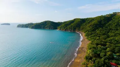an aerial view of the shoreline of a beach at Mar y Selva at Naumi, Ocean Views & Beach Club in Sardinal