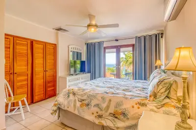 a bedroom with a bed and a window at Bahia Pez Vela Villa at 18 in Ocotal