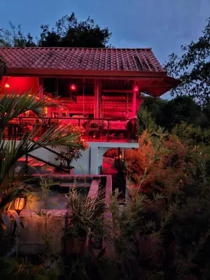 a building with red lights on the side of it at La Uvita Perdida in Uvita