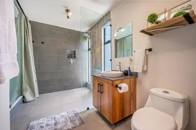 a bathroom with a toilet and a sink and a shower at Casa Nonos in Libertad