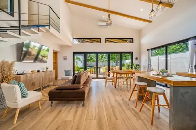 an open living room with a kitchen and dining room at Casa Nonos in Libertad