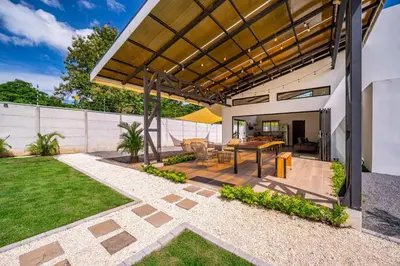 a patio with a table in a backyard at Casa Nonos in Libertad