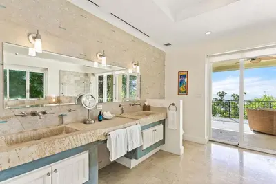a large bathroom with two sinks and a large window at Papagayo Villa w Ocean Views and 2 Private Pools in Nacascolo