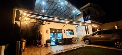 a car parked in front of a house at night at Villa Don Juan in Rivas