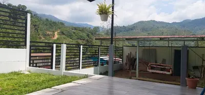 a balcony of a house with mountains in the background at Villa Don Juan in Rivas